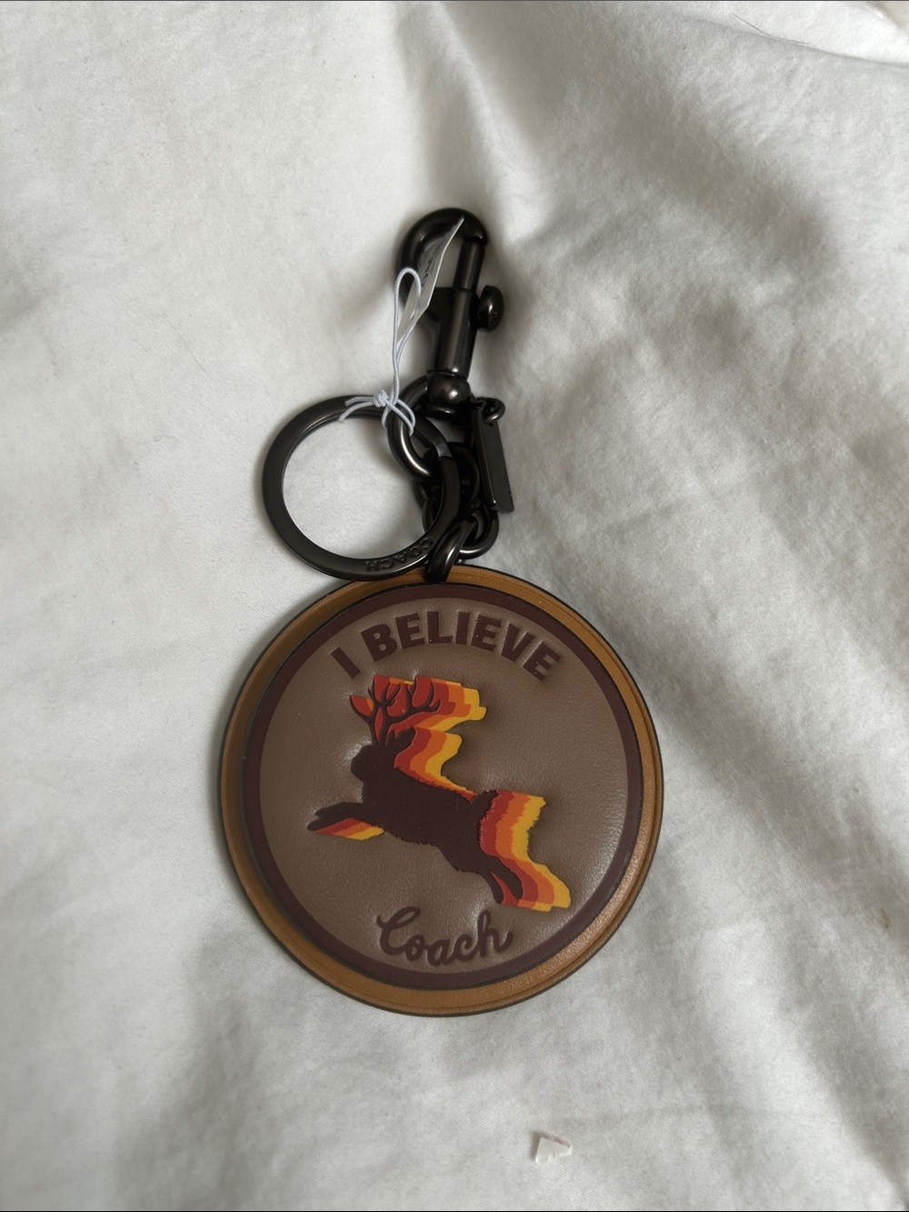 Coach Brown Round 'I Believe' Stag Key Fob with Red and Yellow Accents